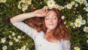 Woman laying in flowers