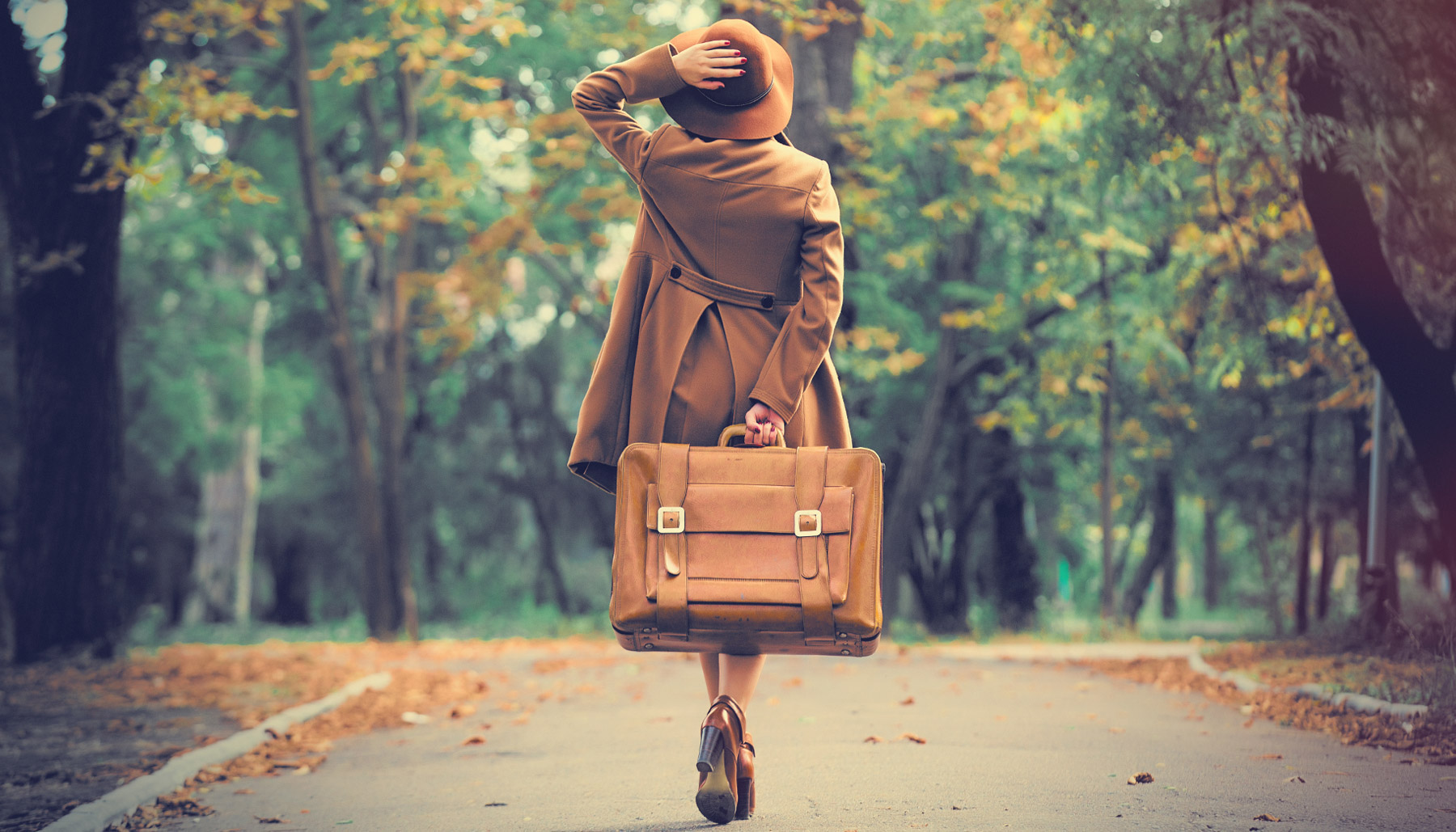 Woman with old suitcase