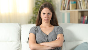 Angry woman on couch